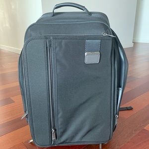 tumi backpack wheels